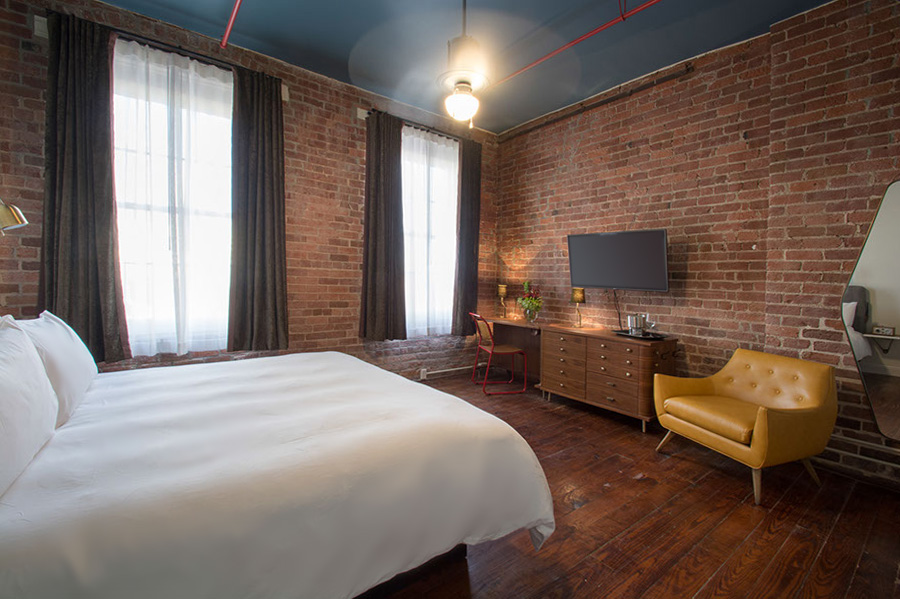 A spacious King bed, exposed brick, brand new walk in shower, massive windows and stylish décor.